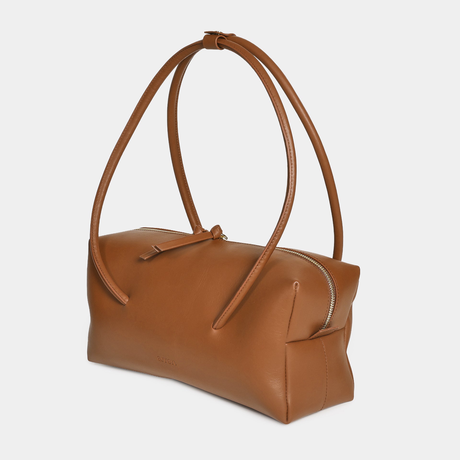 Carol borsa Made in Italy in pelle caramello scultorea grafica modello east west con manico di design brand Arron vista laterale