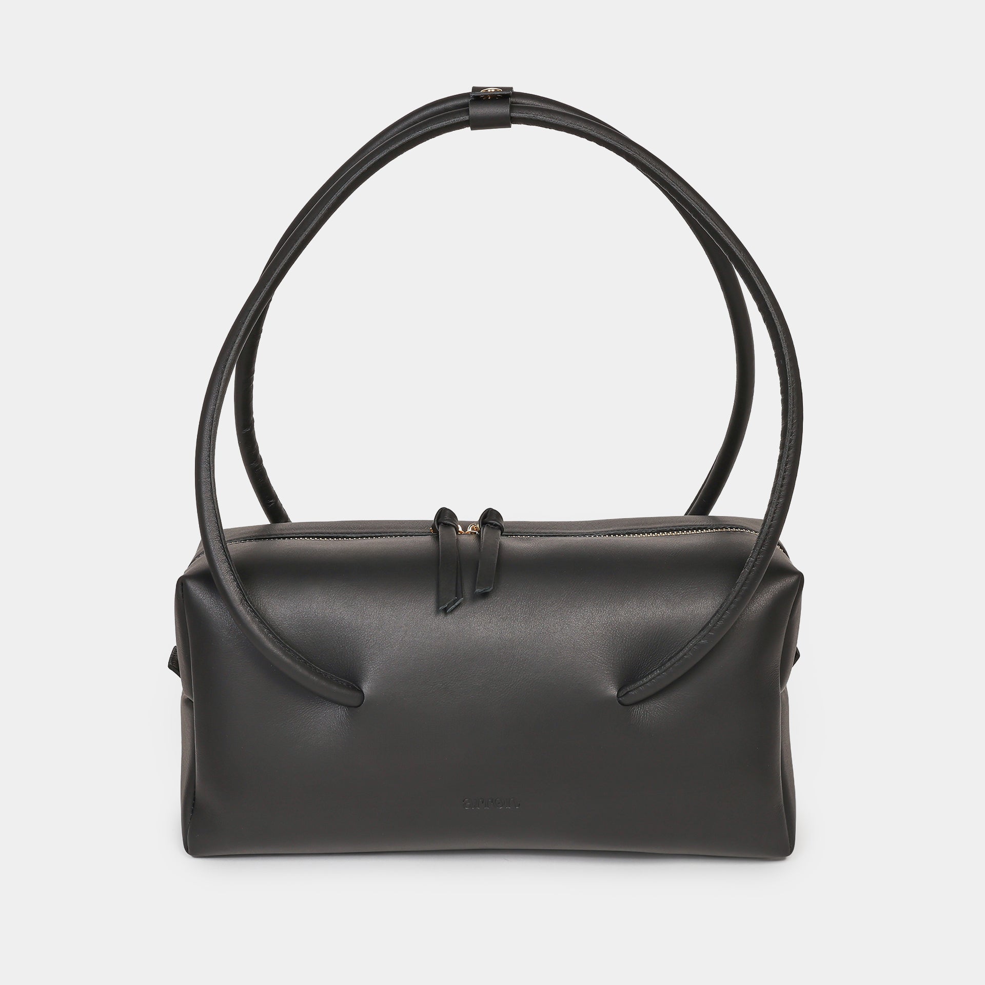 Carol borsa Made in Italy in pelle caramello scultorea grafica modello east west con manico di design brand Arron vista frontale